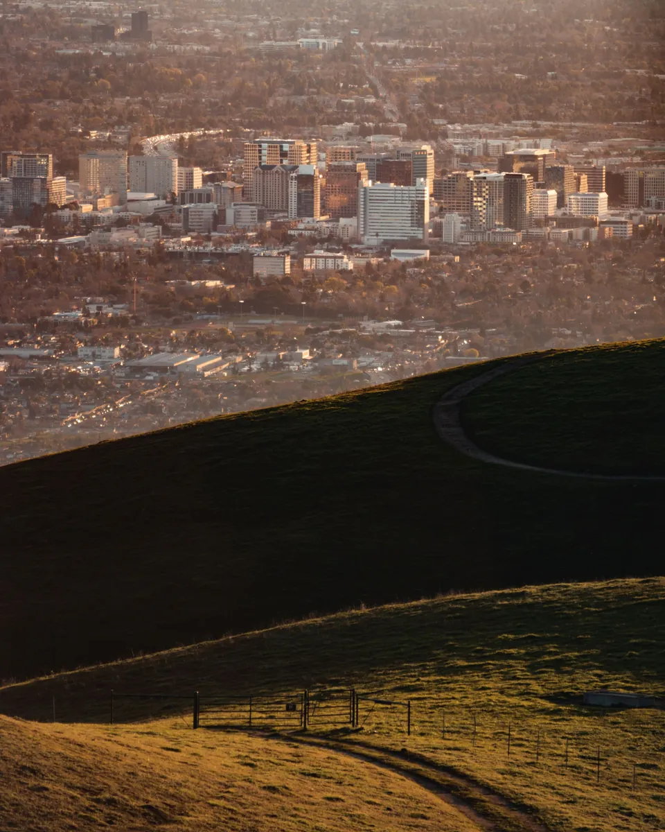 Downtown San Jose, CA seen at sunset from the rolling foothills east of the city