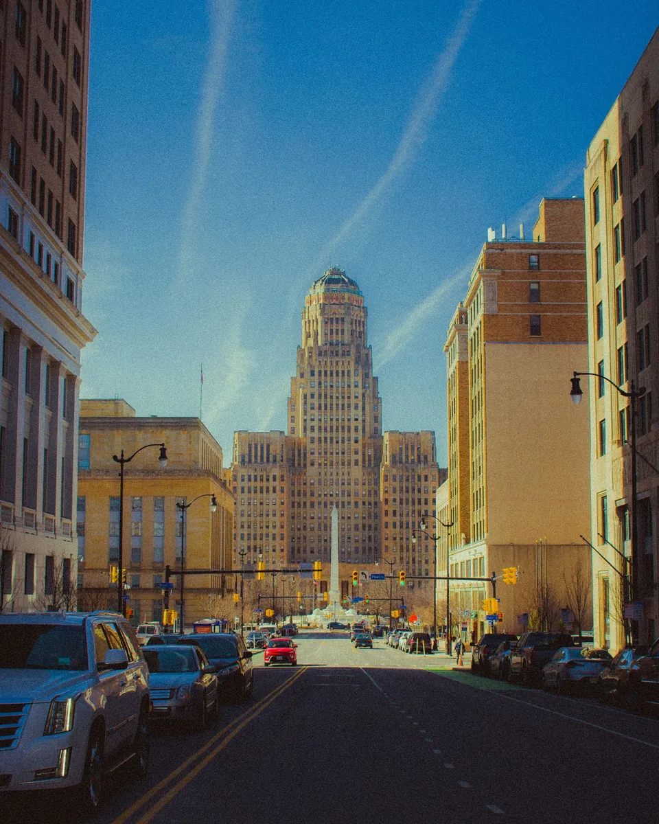 Art Deco Buffalo City Hall at the end of a downtown street in Buffalo, NY
