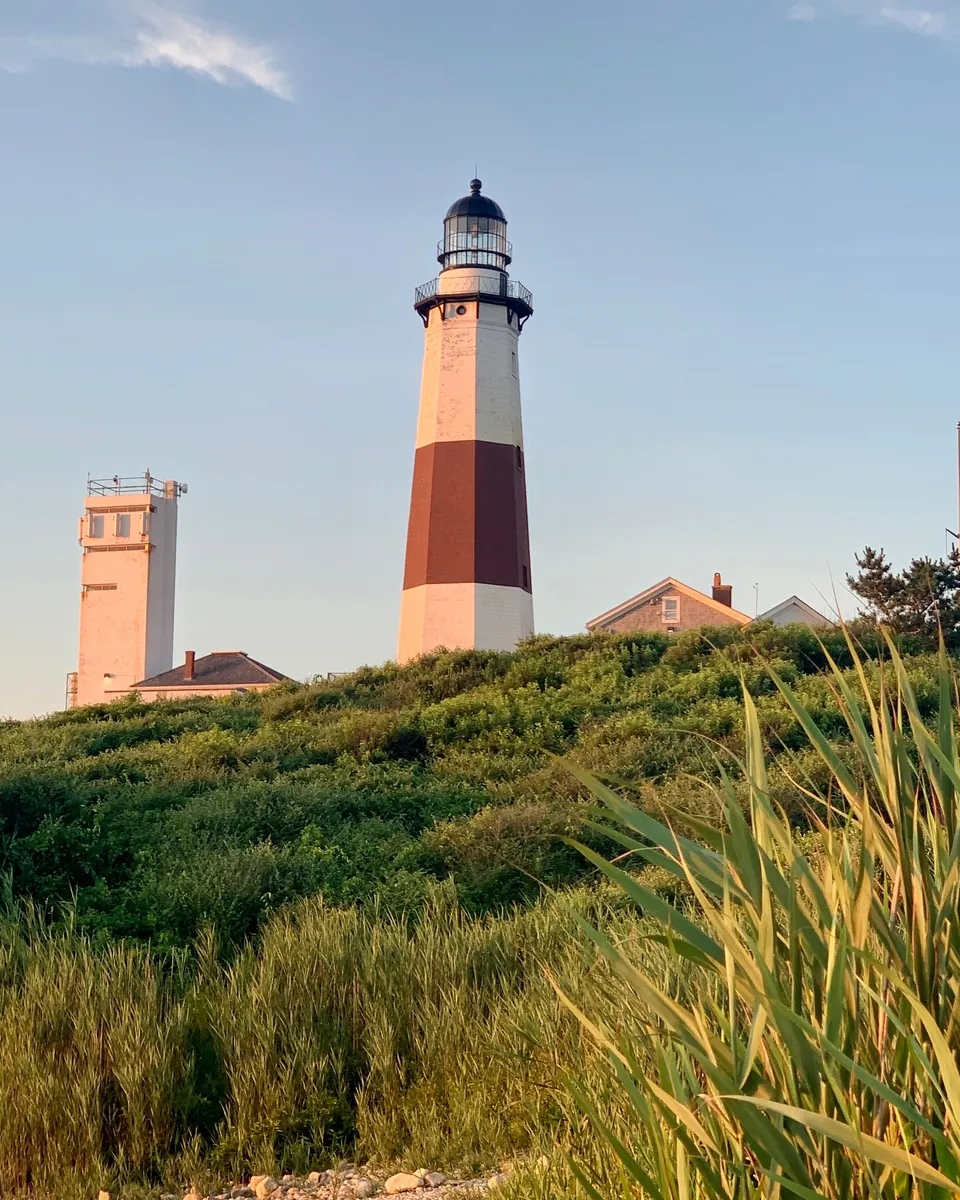 Montauk Point Lighthouse above the dune grass at the eastern tip of Long Island, NY