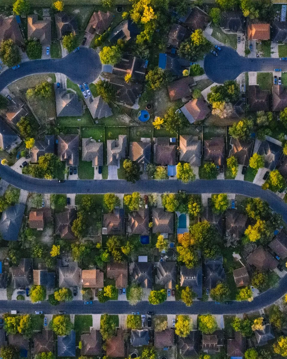 Aerial view of a tree-lined neighborhood in Edinburg, TX in the Rio Grande Valley