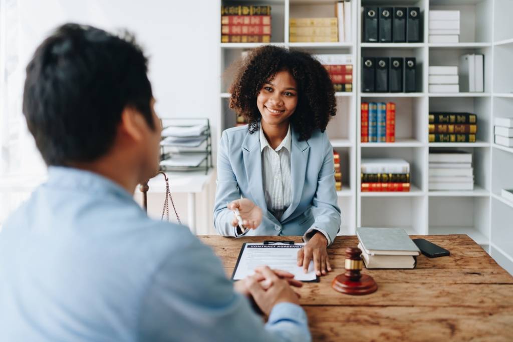 A tax attorney going over business documents with a client.