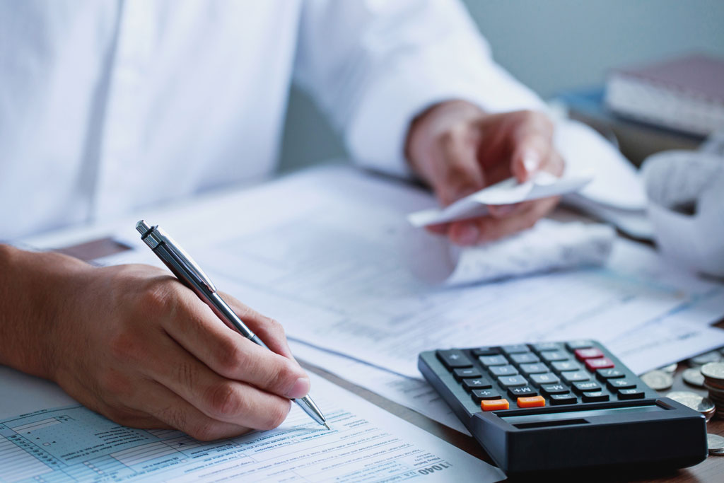 Close up of man filing tax return ahead of tax season